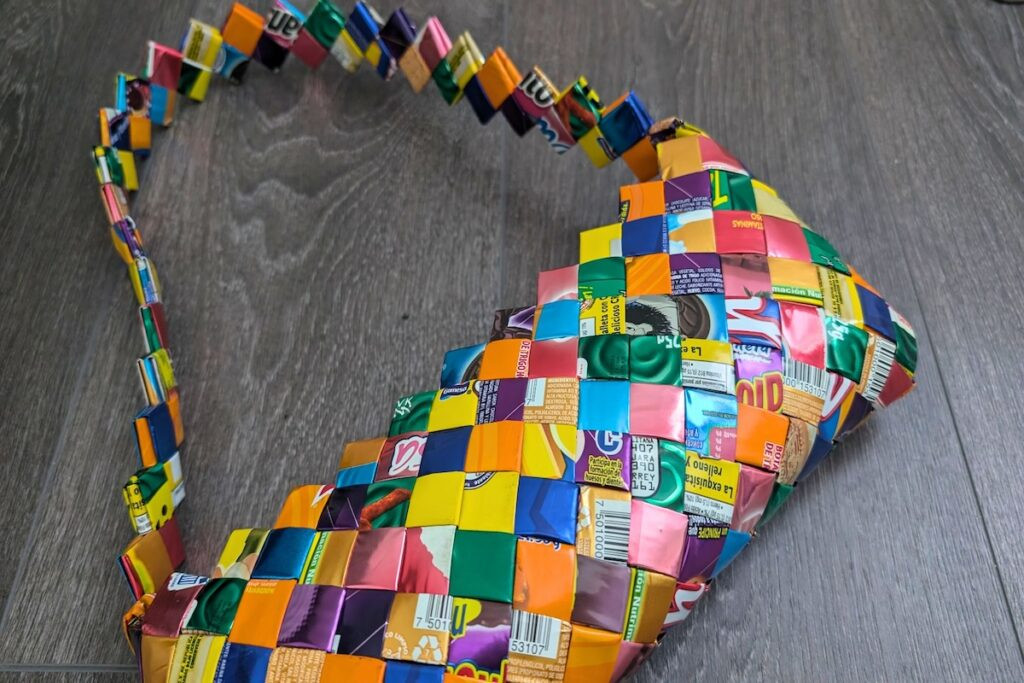 A colorful purse made from Mexican candy wrappers, showcasing local craftsmanship