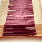 Accordion-fold tissue paper from the short side in 1-inch folds.