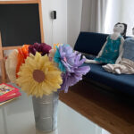 Tissue paper flowers in a French flower bucket.