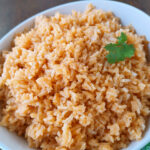 Mexican Restaurant-Style Rice! A simple recipe with just a few ingredients just like the rice at our favorite Mexican restaurant and a perfect side dish to serve at home with your favorite Mexican recipes!