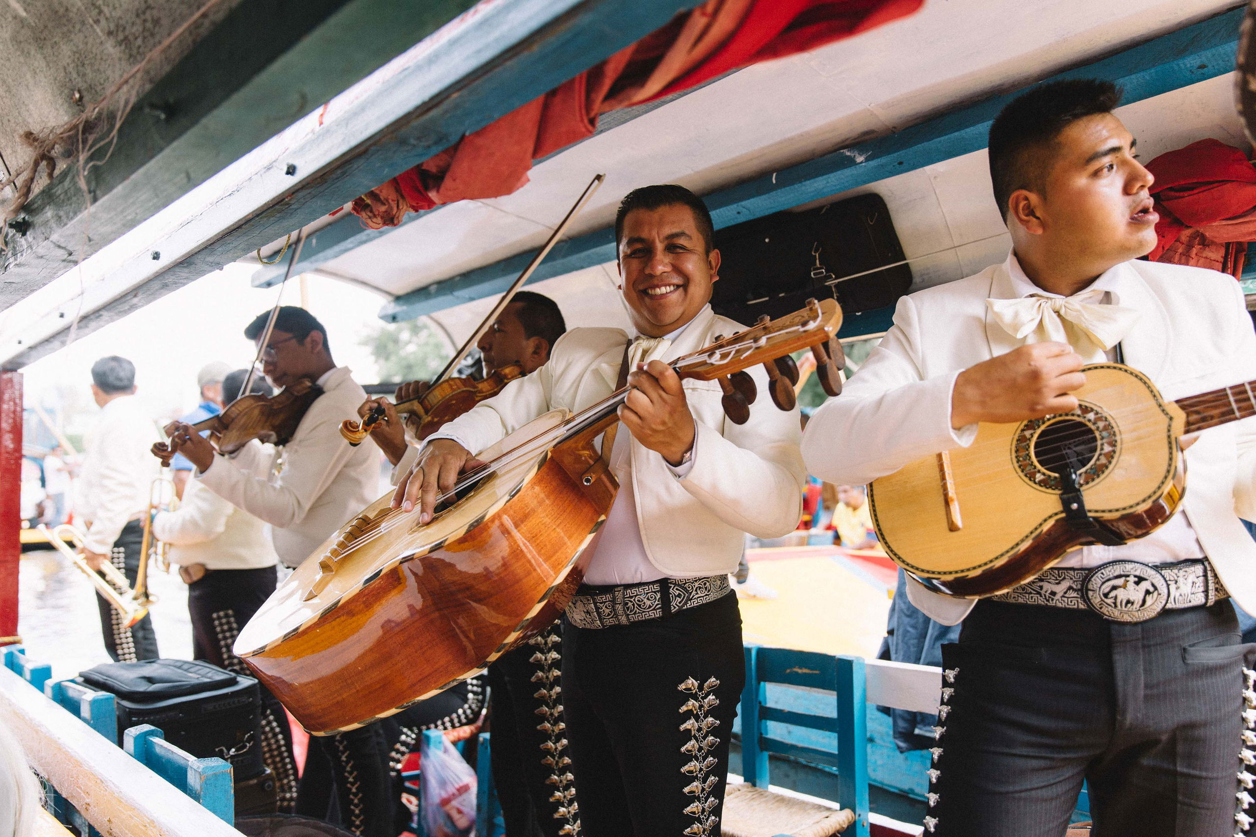 A vibrant Mariachi band playing traditional music during celebrations in Mexico, showcasing Mexican Christmas traditions and cultural festivities. Perfect for a Mexico tour or trip to Mexico during the holiday season.