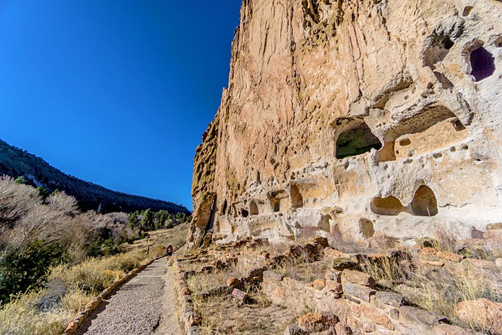 Anasazi dwellings in Bandelier National Monument, showcasing ancient structures carved into volcanic rock