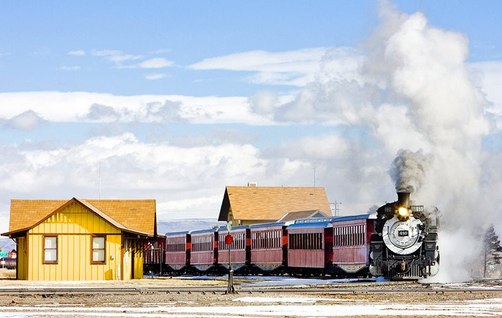Cumbres-Toltec Scenic Railway, a vintage steam train traveling through picturesque mountain landscapes