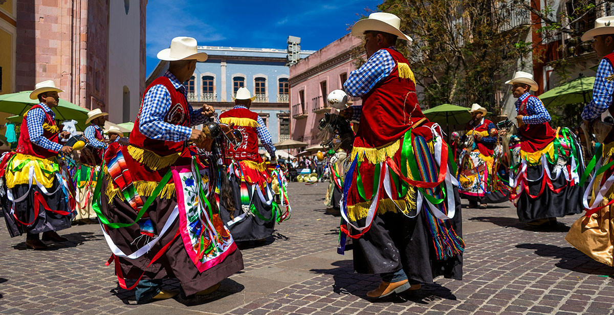 Group of people dancing at a cultural event in Puerto Rico, embracing LGBTQ+ community participation.