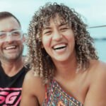 Couple enjoying a beach in Puerto Rico, showcasing LGBTQ+ friendly travel destinations.