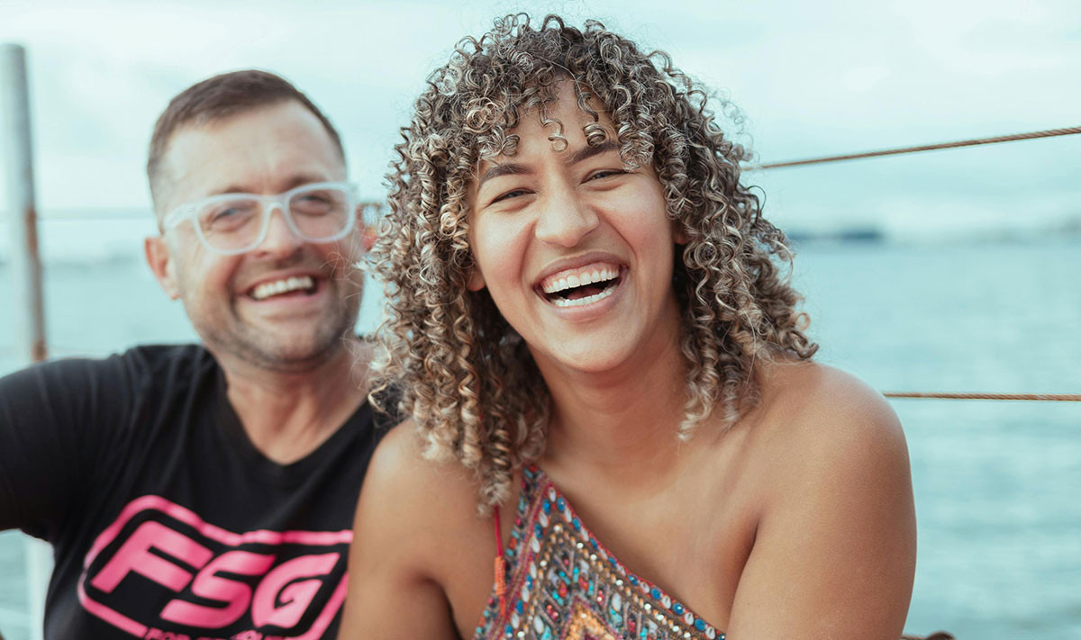 Couple enjoying a beach in Puerto Rico, showcasing LGBTQ+ friendly travel destinations.