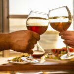 People toasting with white wine
