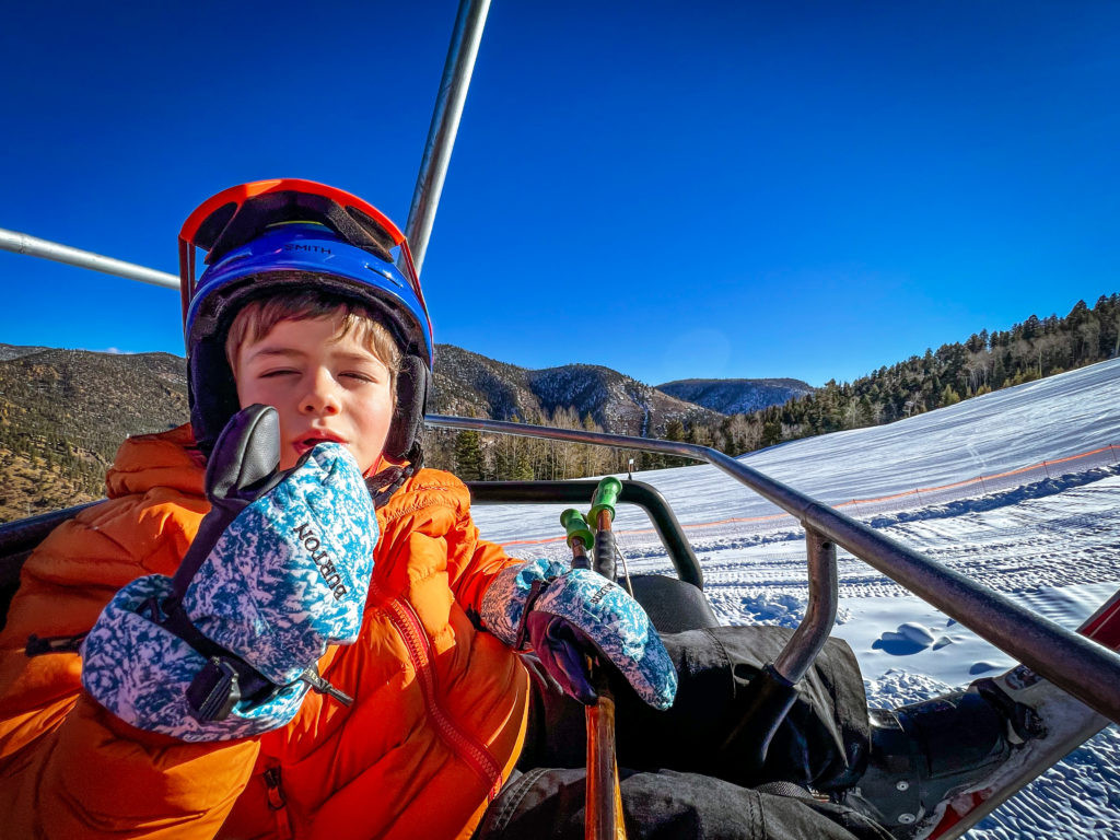Enthusiastic Forest ready with a thumbs-up from the Gold Chair, eager to ski
