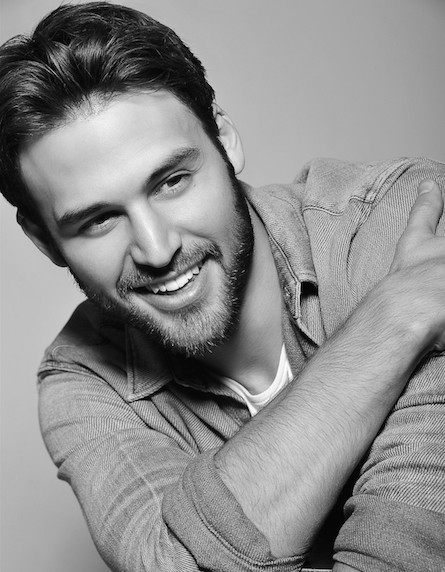 Ryan Guzman poses during a fashion shoot at Sacramento International Airport, a pivotal moment that predates his successful acting career.