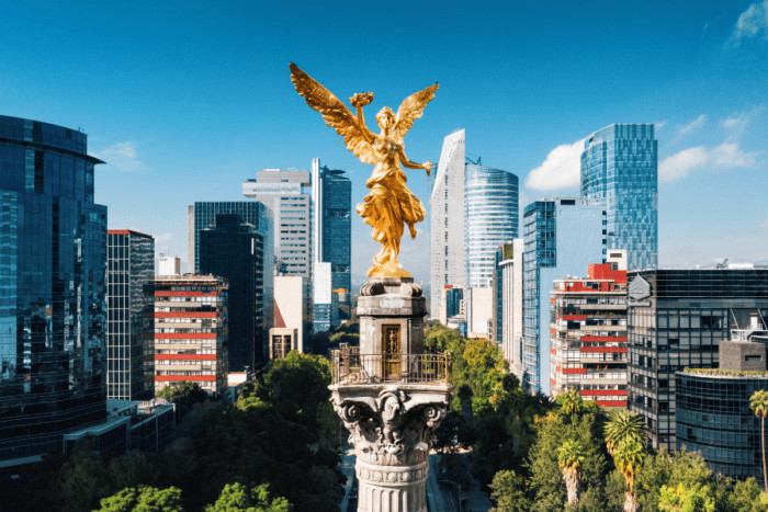 A vibrant street scene in Mexico City, capturing the city's rich history, cultural diversity, and the bustling atmosphere that makes it one of the safest major cities in Mexico