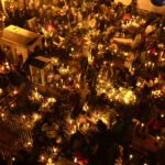 Gravesites illuminated by candlelight during Day of the Dead celebrations in San Andres. Shutterstock