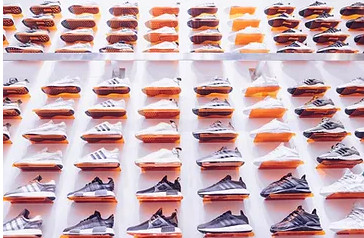 Colorful array of shoes displayed at a vibrant tianguis in Mexico, showcasing a diverse selection of styles and materials