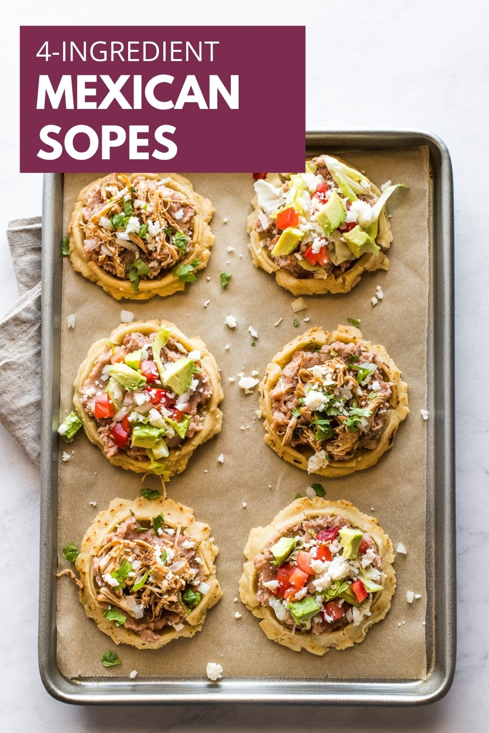 Delicious sopes with various toppings, perfect for sharing at an LGBTQ+ gathering.