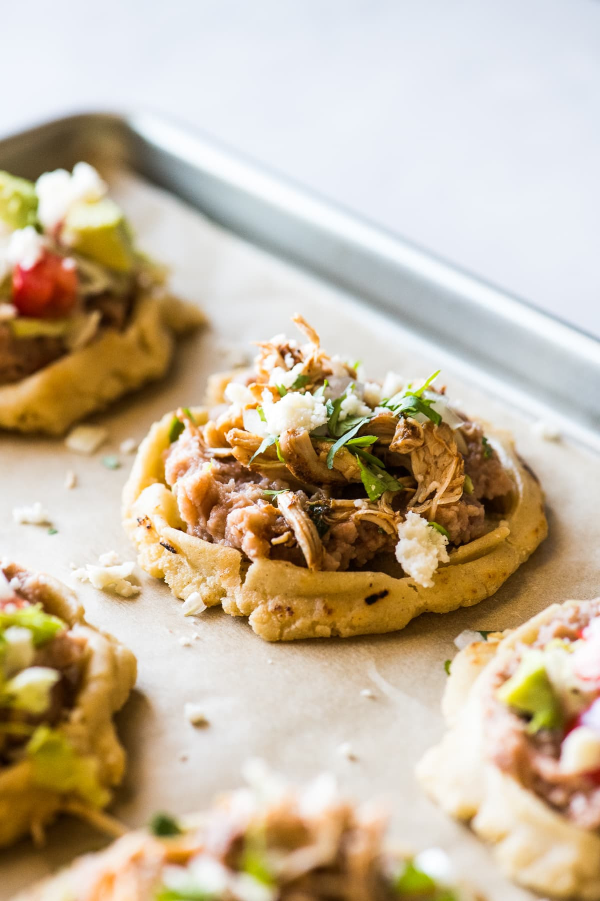 Sopes ingredients including masa harina, salt, and toppings.