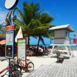 Bicycles parked by a lifeguard station on a boardwalk by the beach in Playa del Carmen