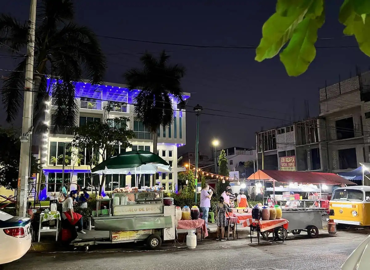 Vibrant street food vendors in La Crucecita at night