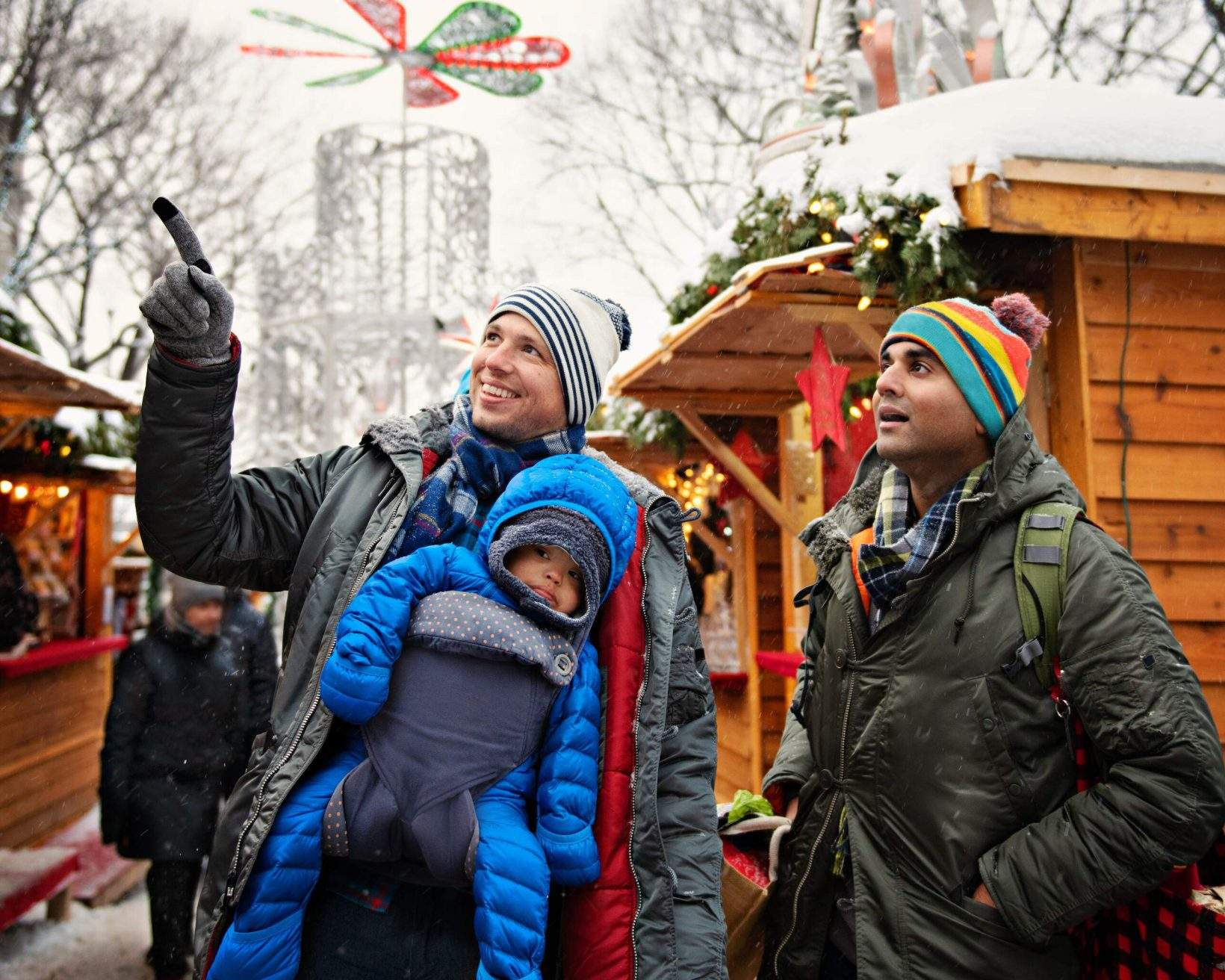 LGBTQ family with child representing inclusive travel experiences