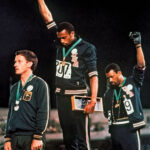 Tommie Smith and John Carlos raising black-gloved fists in protest at the 1968 Olympic Games in Mexico City