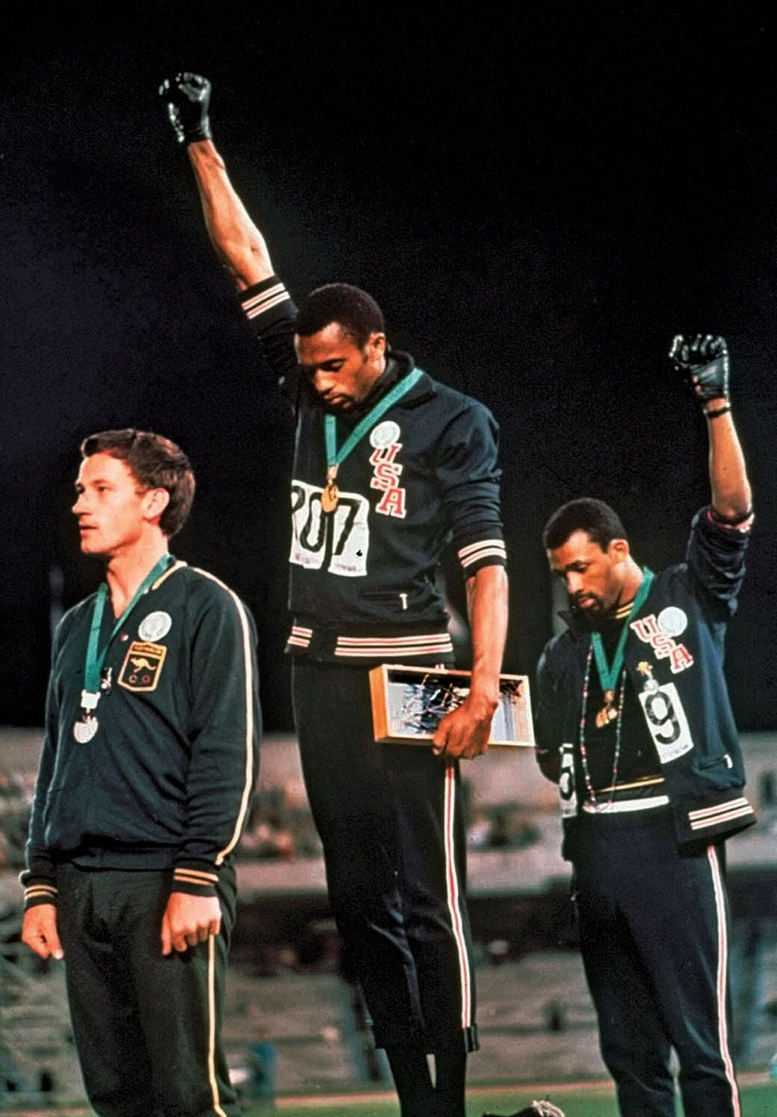 Tommie Smith and John Carlos raising black-gloved fists in protest at the 1968 Olympic Games in Mexico City