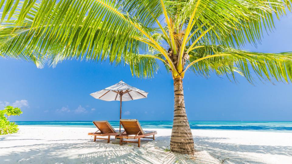 Couple enjoying a sunny day on the beach in Mexico