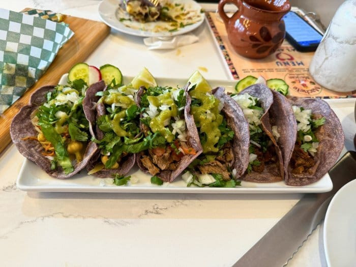 Three tacos on a table