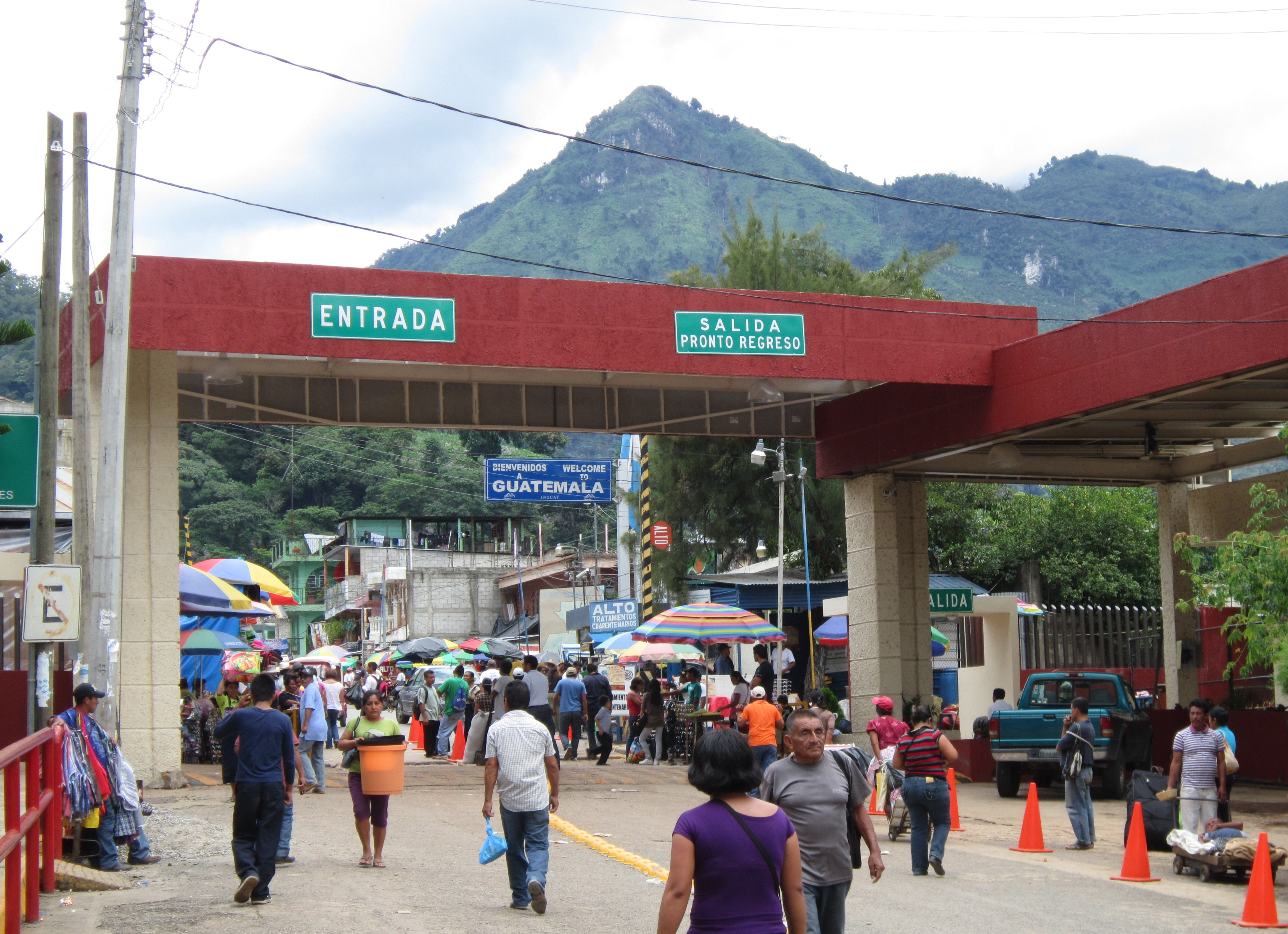 Welcome to Guatemala, Mexico’s friendly neighbor to the south, showcasing a vibrant sign with the country's name amidst lush greenery.