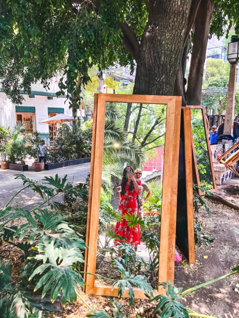 woman in mirror in the park for where to stay in mexico city