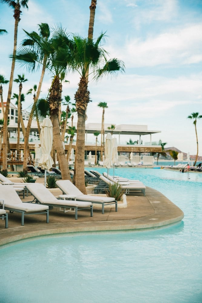 Poolside service at an all-inclusive resort in Mexico, where a friendly waiter serves refreshing drinks.