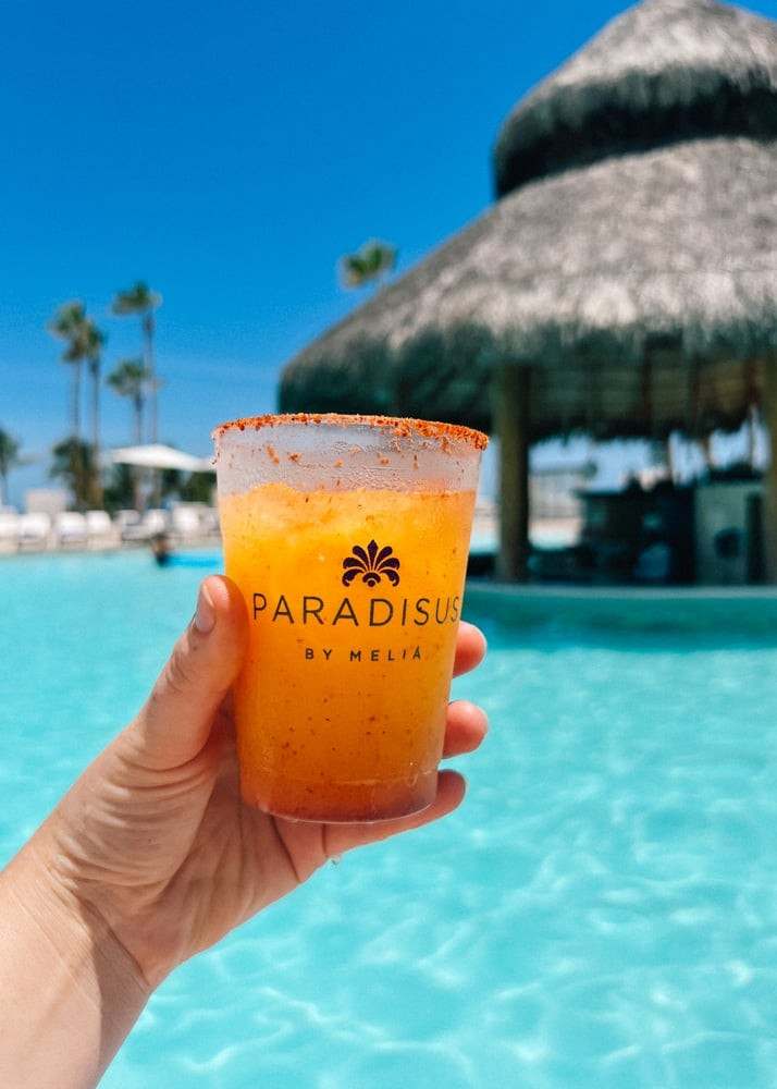 A mango margarita with a tajin rim at a resort in Mexico