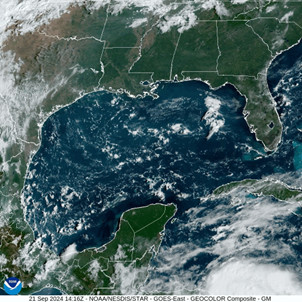 Satellite image of the Gulf of Mexico showing cloud cover and weather patterns, indicating atmospheric activity.